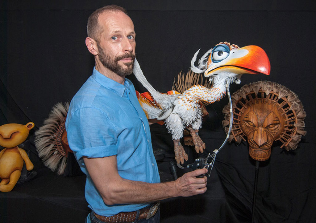 Mike Grimm operating the Zazu puppet. | Photo by Lawrence Carlos