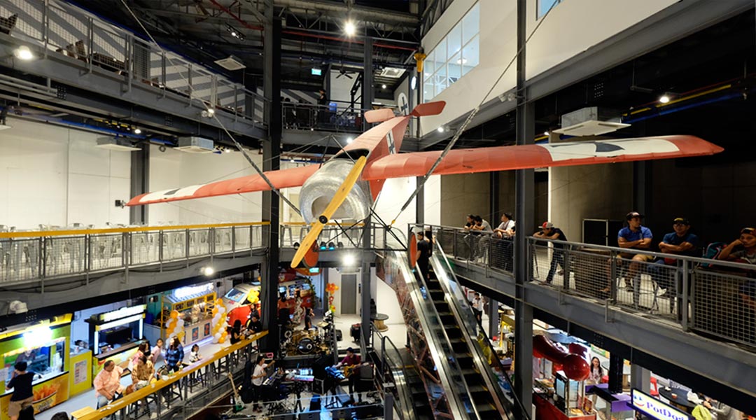 An antique plane from World War I is an eye-catching installation in the atrium of the L.A. Village of the Laperal Apartments.